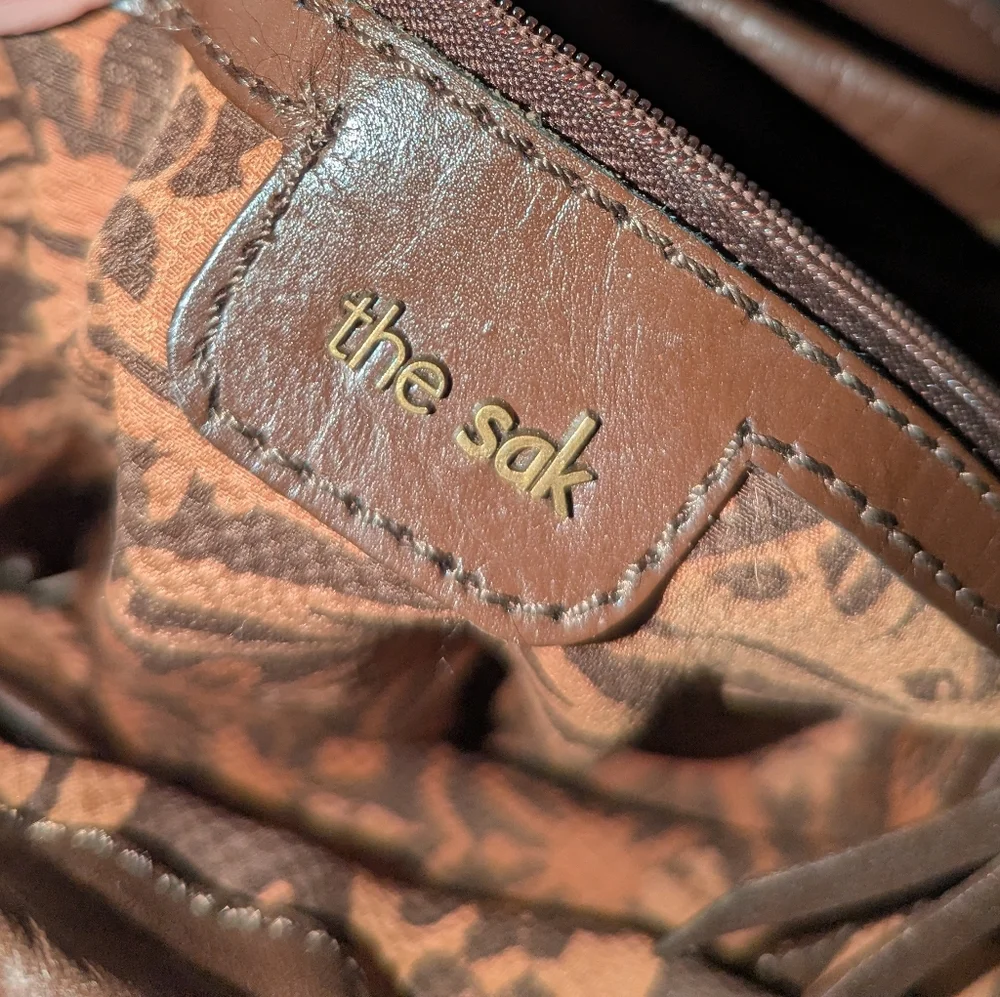 The Sak Brown Weave and Leather Backpack.